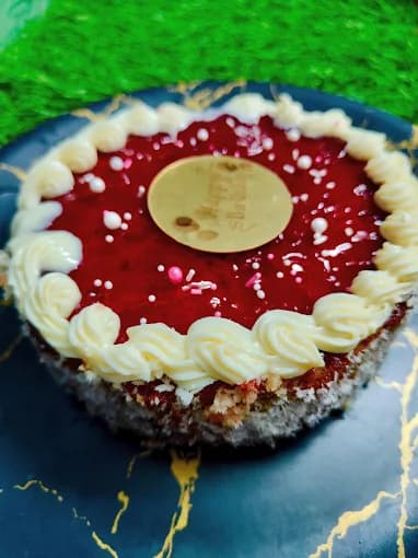 Custom raspberry cheesecake with piped cream border